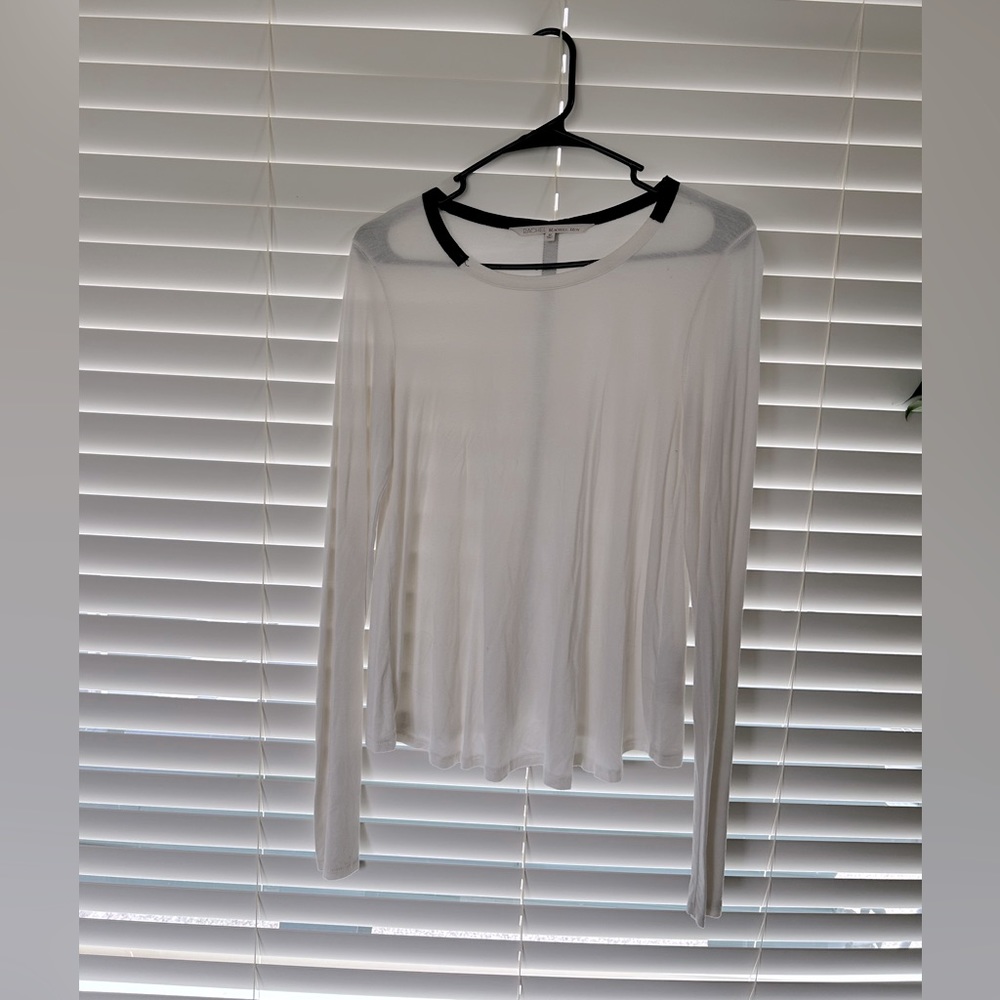 White long sleeve top with black faux leather stripe.